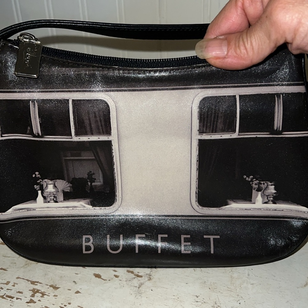Icon double sided image of Buffet leather handbag. L:9x H: 6x W: 1.5